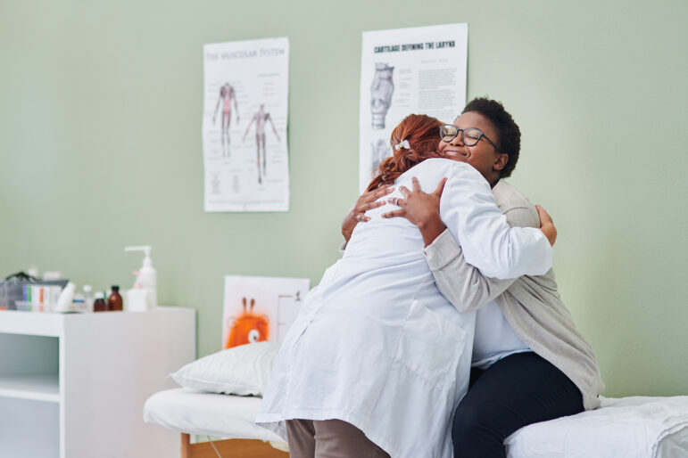 patient hugging their doctor