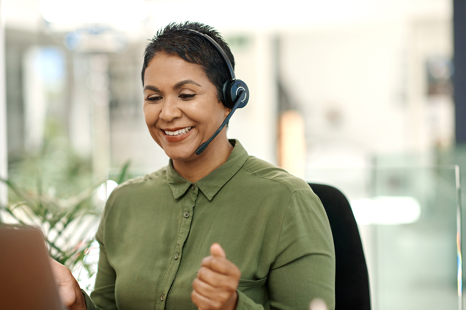 smiling woman wearing call headset