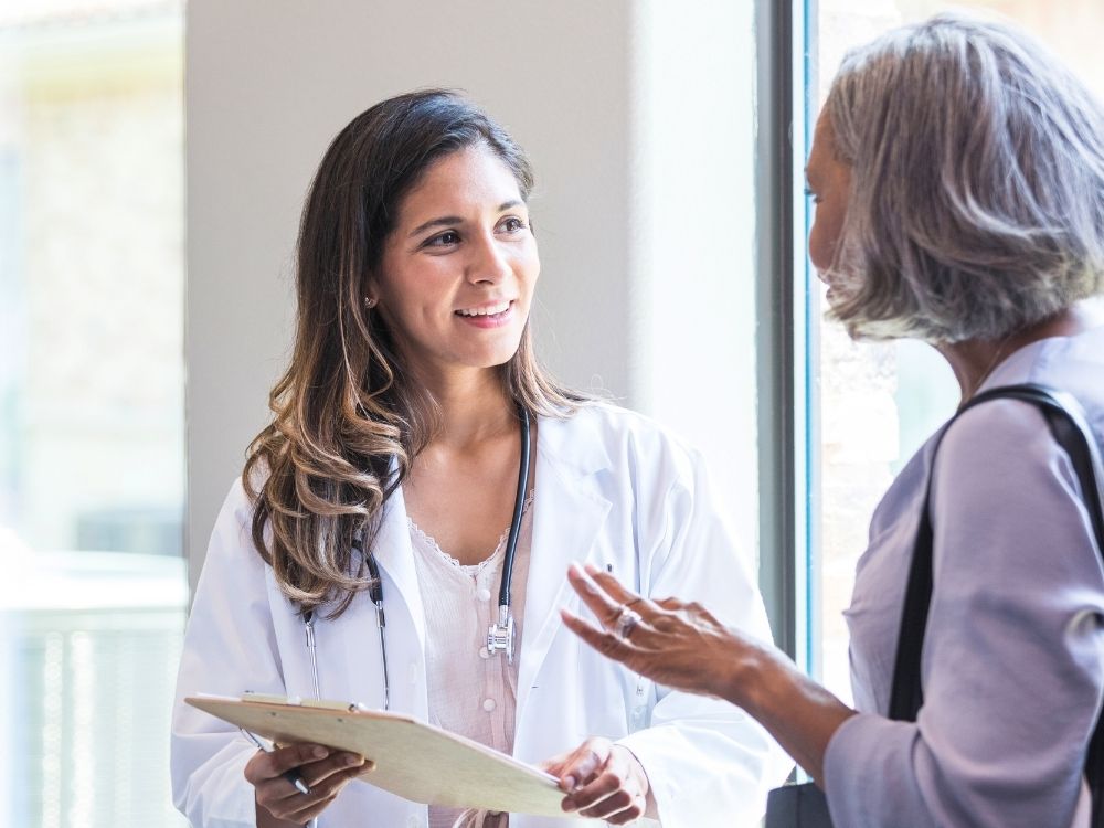female doctor talking to a patient