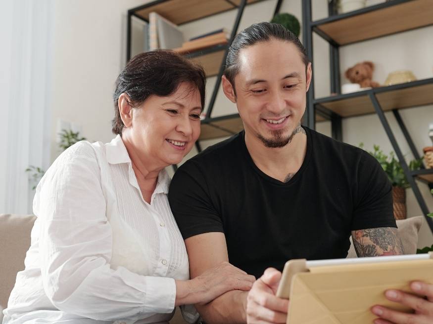 two people looking at tablet together