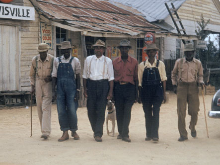 Six Black men walking on road