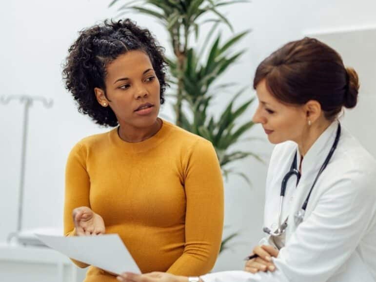 woman talking to her doctor