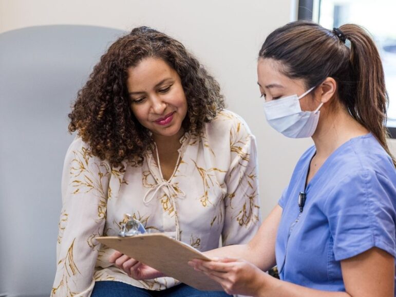 patient listening to a healthcare provider explain something