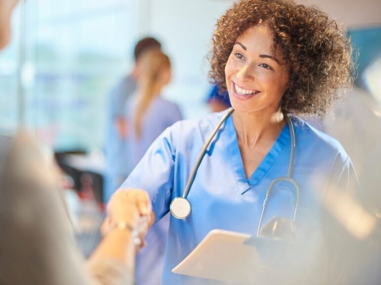 nurse shaking patient's hand