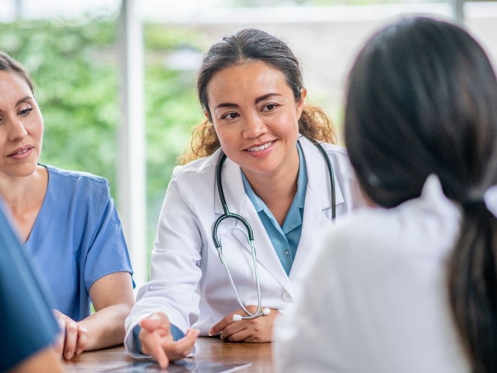 patient man talking to doctor