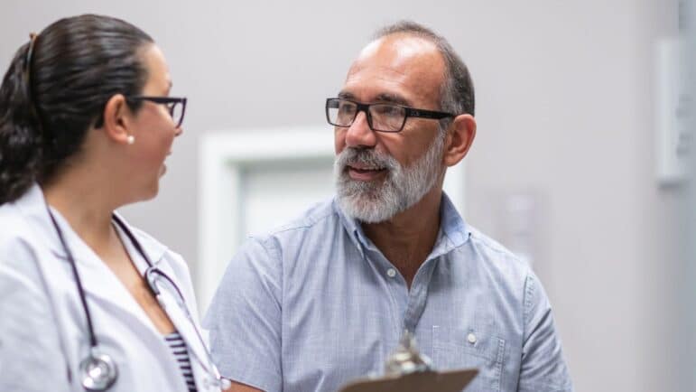 patient man talking to doctor