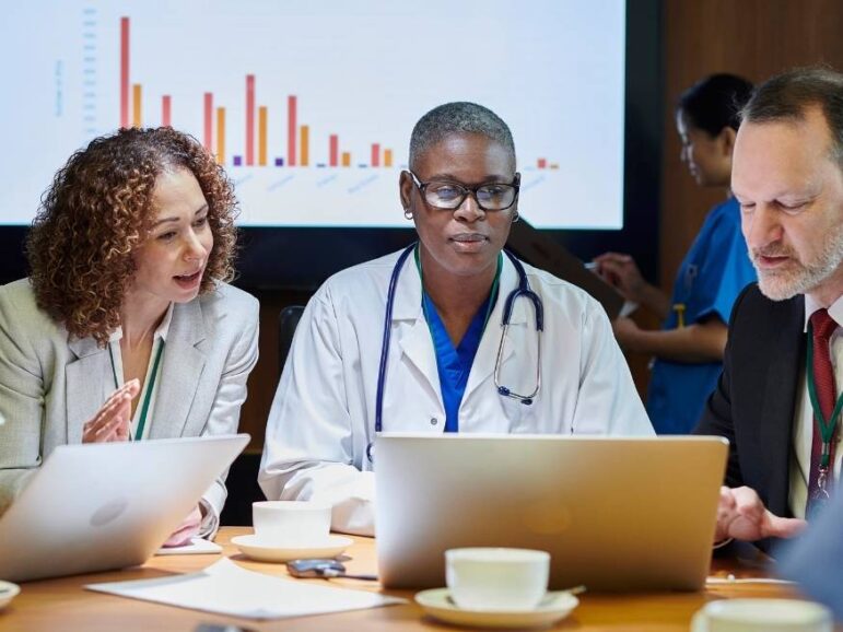 group of researchers looking over data